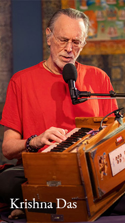 Krishna Das playing the harmonium