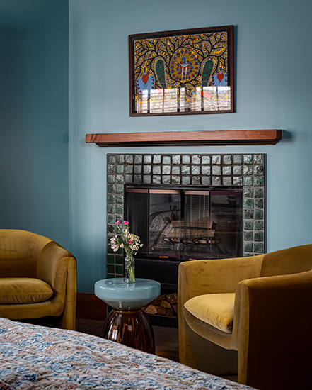 sitting area by the fireplace in the Ganga room at SoHum Mountain Healing Resort