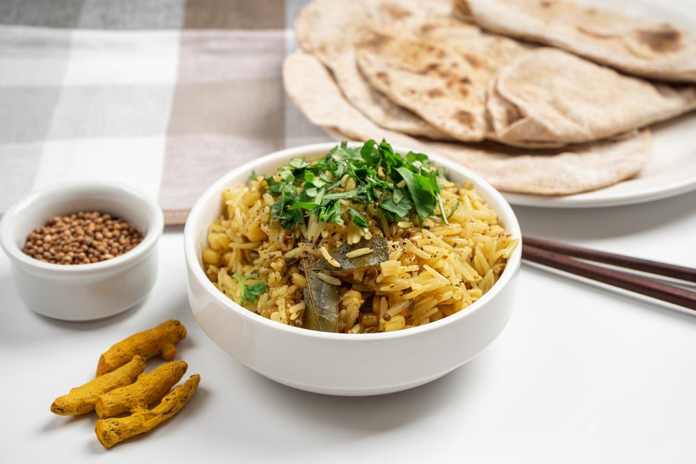 A bowl of kitchari on a table.