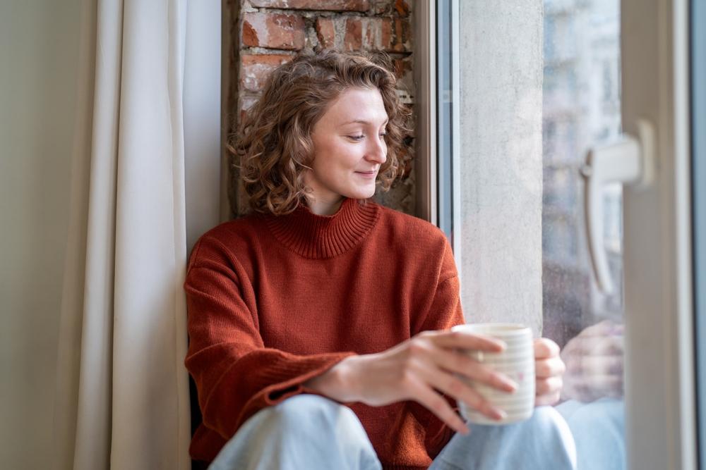 A woman practices self care after experiencing the effects of burnout.
