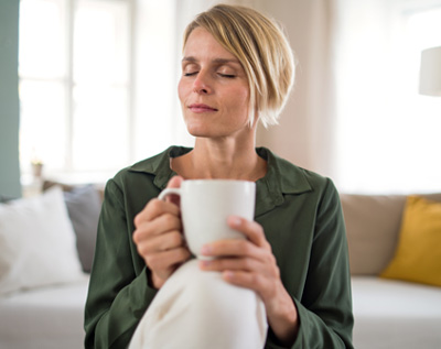 woman holding a mug of tea