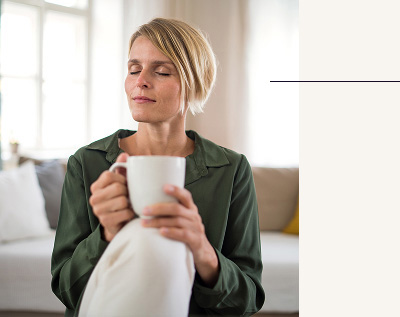 woman holding a mug of tea
