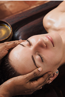 woman getting an Ayurvedic treatment at SoHum Mountain Healing Resort