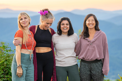 women standing in front of the Blue Ridge mountains outside of SoHum Mountain Healing Resort